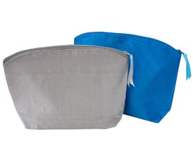 Silk cosmetic bag with zipper closure in blue and silver