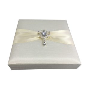 Embellished wedding box with silk and brooch