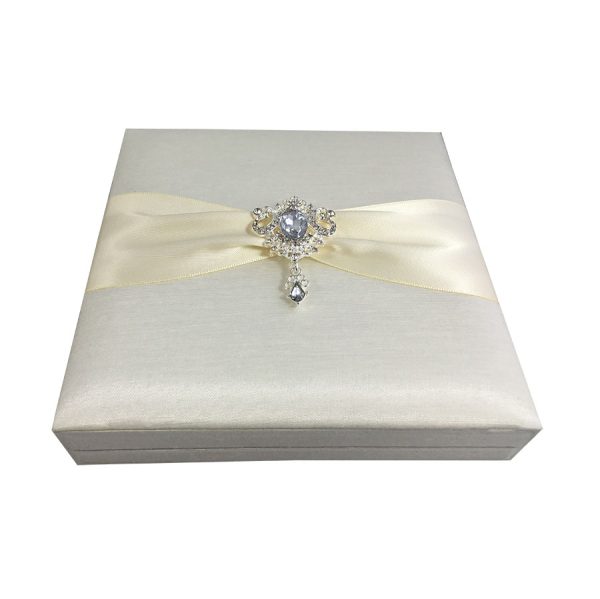 Embellished wedding box with silk and brooch