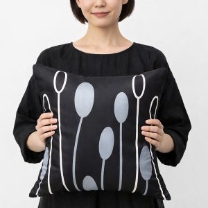 Modern printed nature inspired Thai silk cushion in black