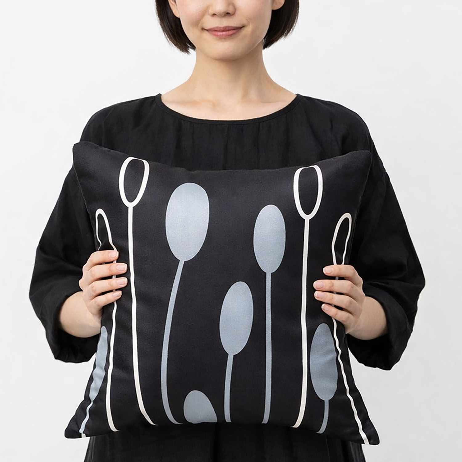 Modern printed nature inspired Thai silk cushion in black