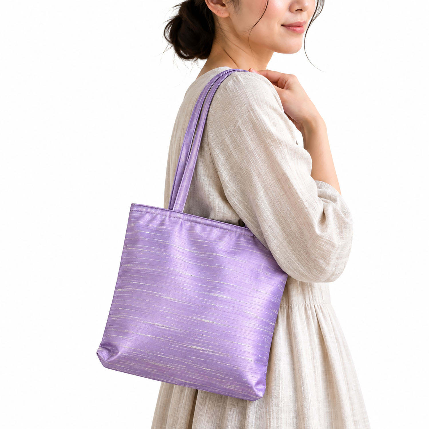 women holding our Thai silk handbag over shoulder
