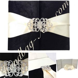 black velvet invitation with rhinestone clasp