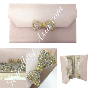 blush pink silk envelope with crystal bow for sweet sixteen and wedding invitation cards