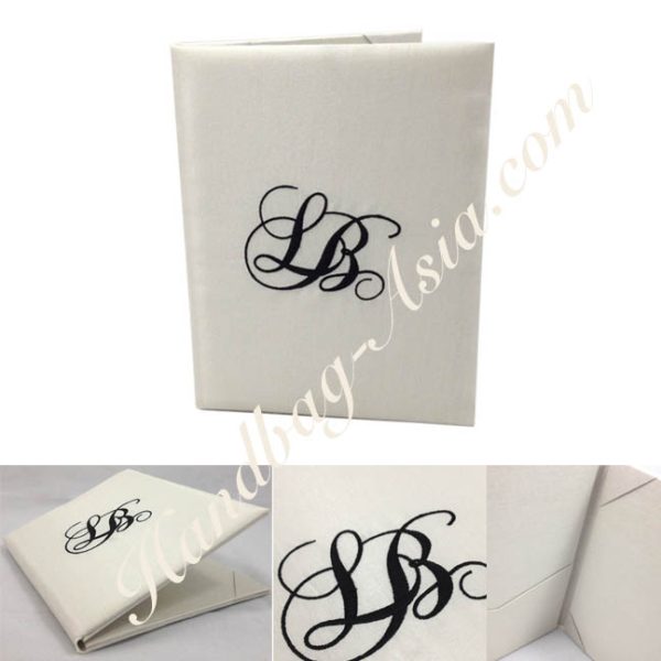Monogram embroidered wedding book-fold invitation