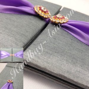 Luxury silver wedding invitation with brooches
