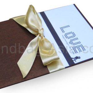dark brown silk pad for cards with golden bow embellishment