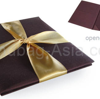 Embellished brown silk folder with golden ribbon