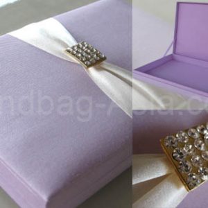 Embellished silk wedding invitation box with crystal brooch