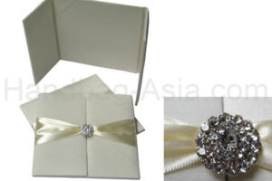 ivory wedding folder with crystal brooch