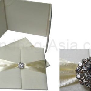 ivory wedding folder with crystal brooch