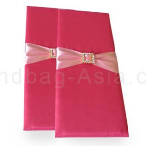 pink silk baker with buckle embellishment