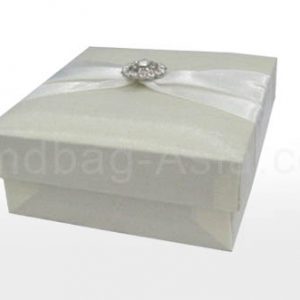 Ivory silk favor box with embellishment