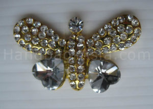 Cute gold plated rhinestone butterfly brooch with clip back and heart crystal