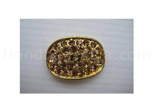 oval rhinestone button in gold