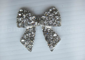 Silver bow embellishment with crystal