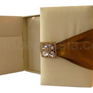 Cream and gold wedding box with crystal brooches and silk cover