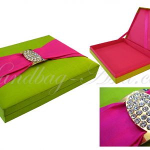 green and fuchsia pink wedding box that is embellished