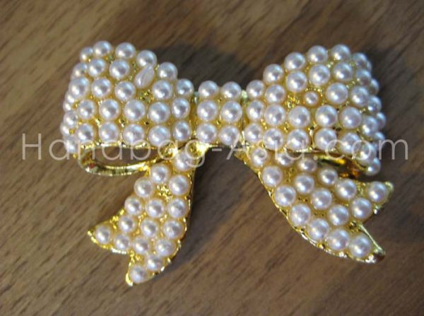 Golden pearl bow embellishment