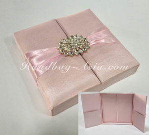 soft pink wedding box with brooch