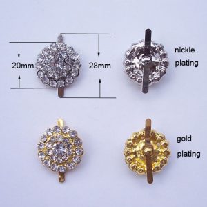 silver and gold crystal button