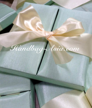 mint green boxed wedding invitation with ivory bow