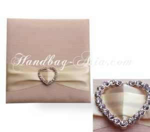 heart brooch embellished wedding invitation