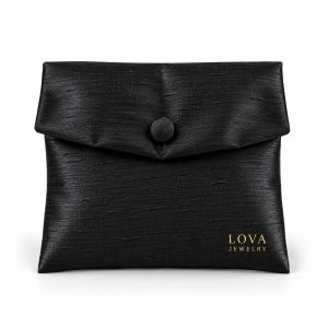 Black silk jewelry envelope pouch with gold logo printing and fabric-covered button closure