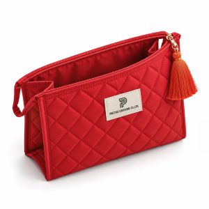 Quilted coton cosmetic bag with tassel