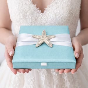 Aqua blue boxed wedding inviattion with starfish brooch