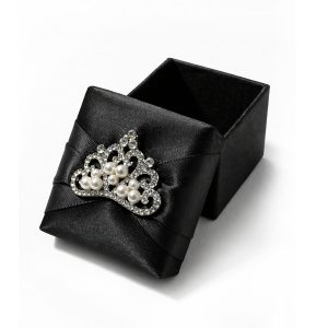 Black silk box for wedding favor featuring rhinestone crown brooch with pearl details