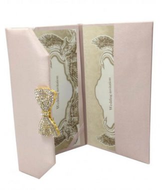 Luxury blush pink wedding envelope with brooch