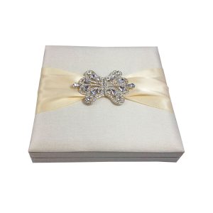 Luxury ivory silk boxed wedding invitation with large crystal brooch