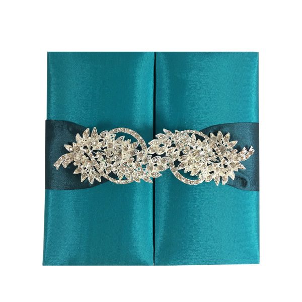 Brooch embellished teal silk box for invitation cards