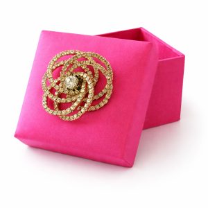 Fuchsia silk favor box with gold plated rhinestone brooch