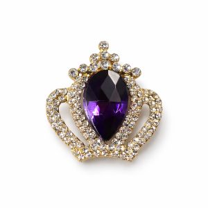 Gold crown brooch with purple center stone from Thailand