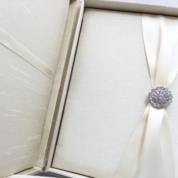 Luxury boxed wedding invitation featuring crystal brooch