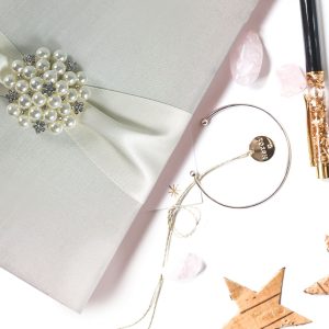 Ivory pearl brooch embellished wedding invitation folio