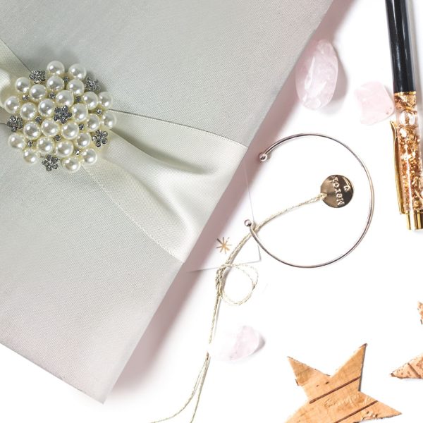 Ivory pearl brooch embellished wedding invitation folio