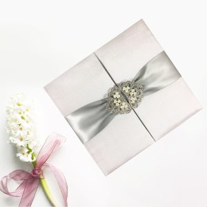 Pearl crown brooch embellished gatefold invitation