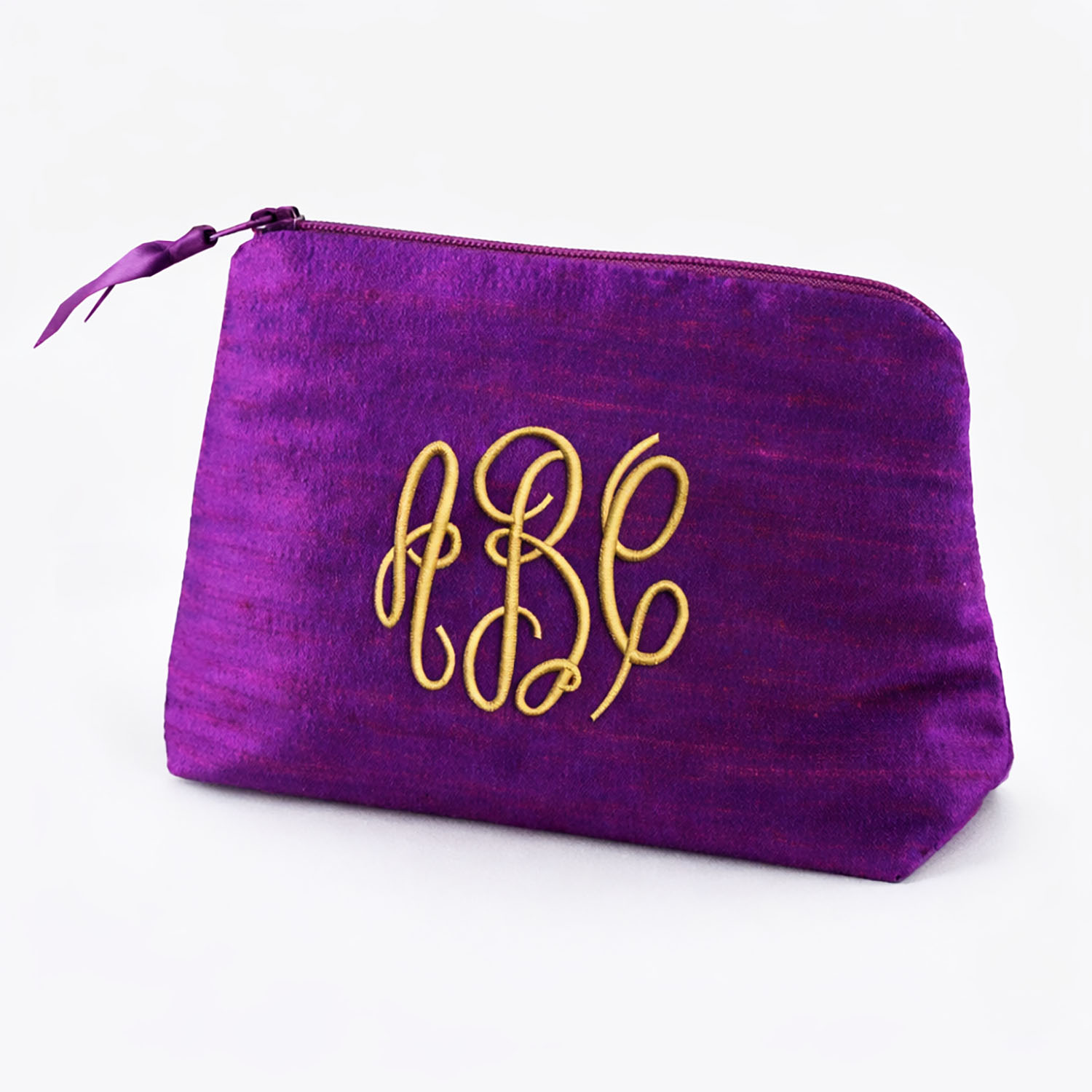 Monogram embroidered purple silk cosmetic bag