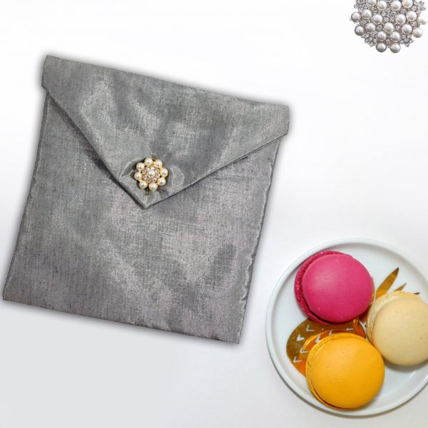 silk envelope with pearl button closure