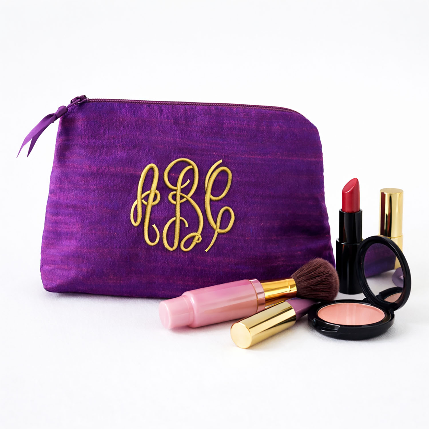 Luxury purple silk cosmetic bag with zipper closure