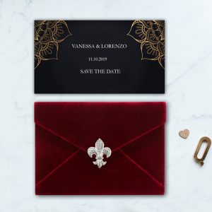 red velvet envelope with brooch