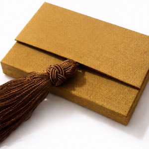 silk business card holder in goldenrod color with tassel and magnet closure