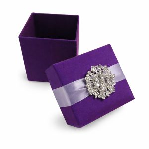Purple silk covered box for wedding favor featuring wedding brooch embellishment