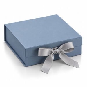 Dusty blue hinged lid rigid box with satin grosgrain ribbon closure, handcrafted from 3 mm paperboard for luxury invitations and gifts.