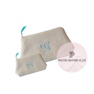 Monogram embroidered cosmetic bags