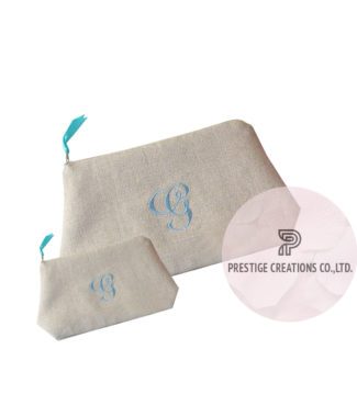 Monogram embroidered cosmetic bags