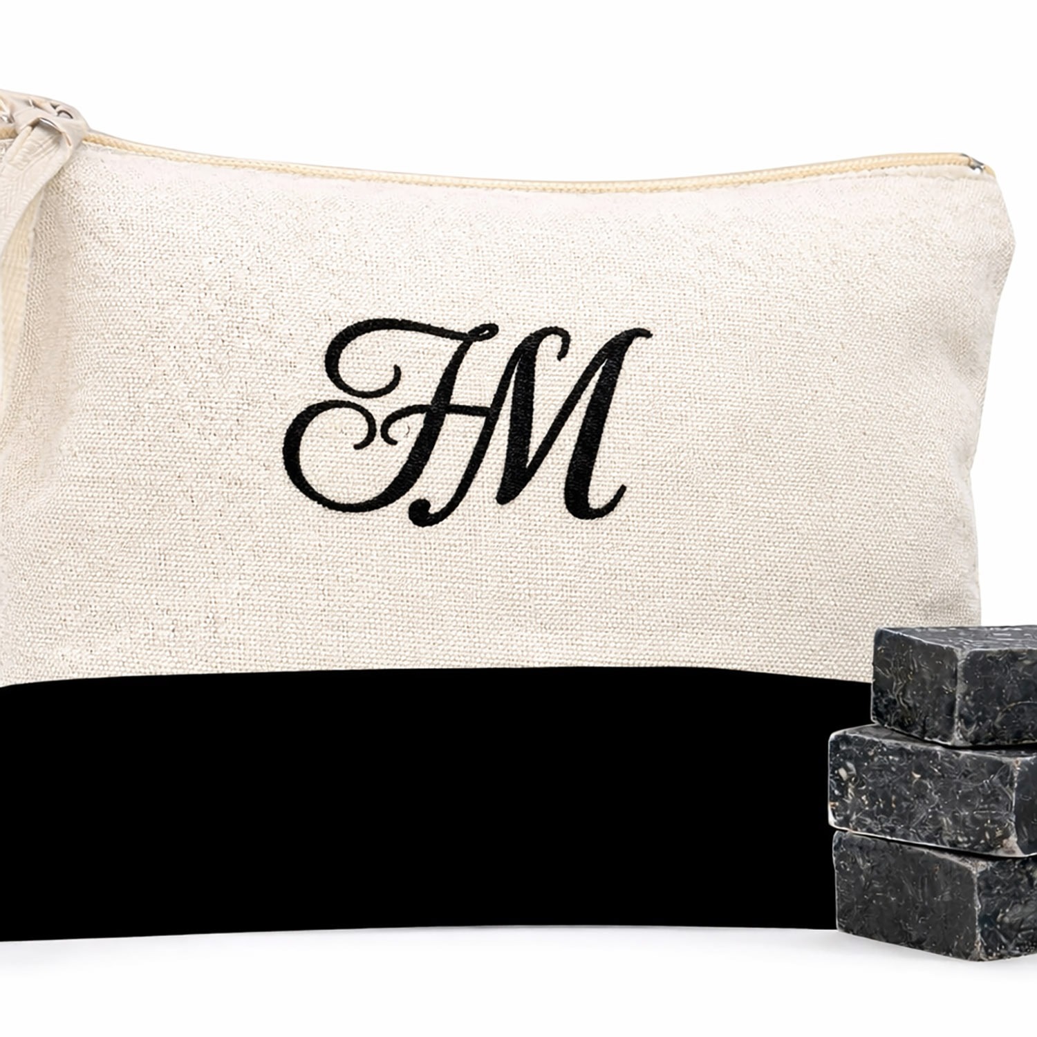 Close up of our two color black and natural cotton cosmetic bag with embroidery